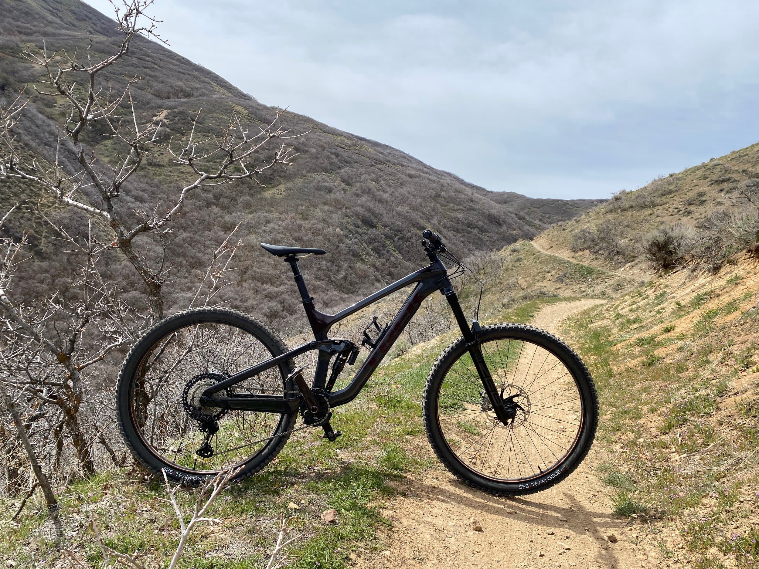 Full suspension mountain bike on a singletrack trail